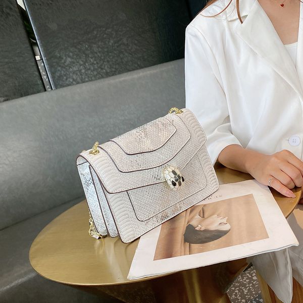 

new handbags hong kong women's 2021 versatile messenger snake head pattern hand advanced sense chain one shoulder small square bag fact