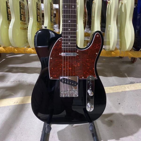 

electric guitar black body rosewood fingerboard red tortoise
