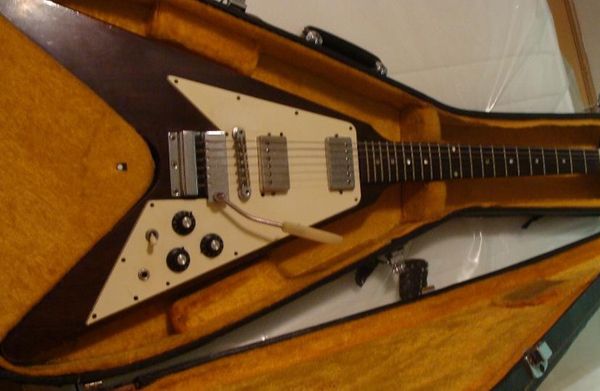 

custom marc bolan christies auction wine brown flying v electric guitar harmonica vibrola tremolo bridge, chrome hardware, tuilp tuners
