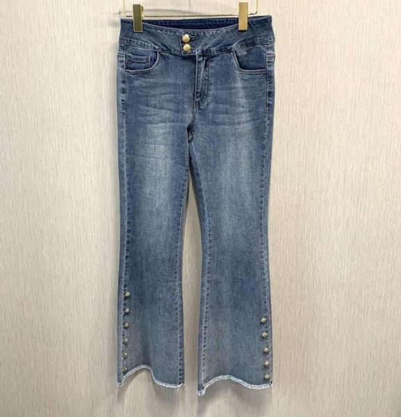 

gold buttons on trouser legs, rough edge, white washed jeans, and slim, Black;white