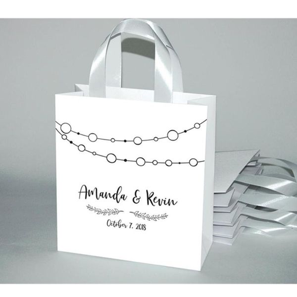 

gift wrap personalized wedding welcome bags with satin ribbon and custom names for your guests weddings party gifts favors