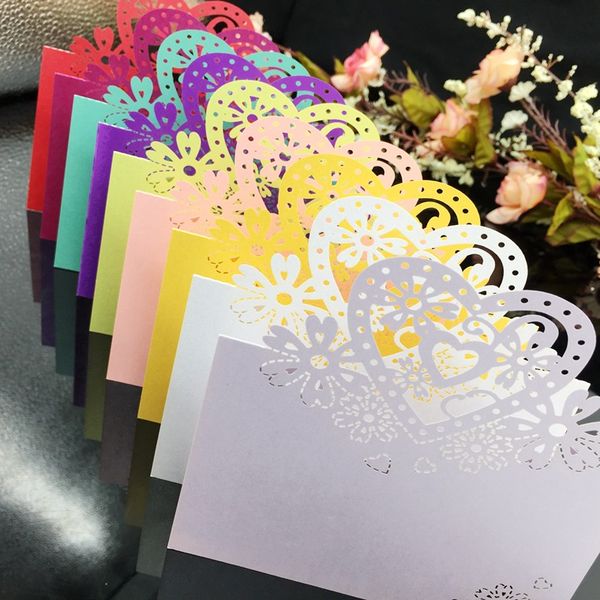 

laser cut place cards party table decorations with hearts flowers paper carving name lables weddings