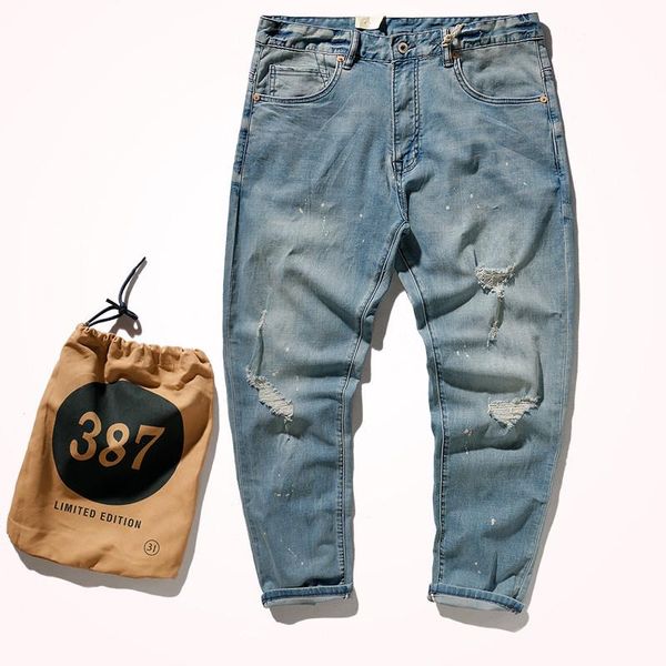 

spring and summer men's fashion light blue thin denim jeans slim washed old holes elastic pencil pants with cloth bags