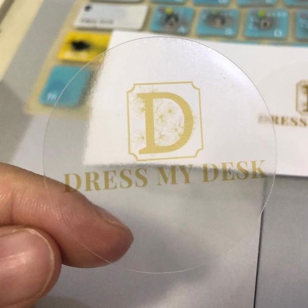 

4.5cm clear transparent sticker with your customized logos in gold print gift wrap