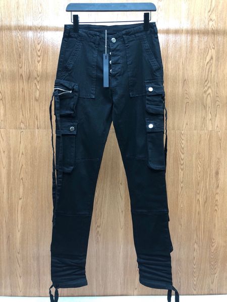 Мужские роскоши дизайнерские джинсы карманные инструменты черные тощие молнии колена заклинание высочайшего качества мода джинсовый человек брюки ткани
