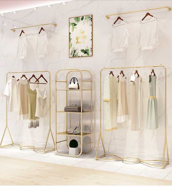 

hangers & racks clothing store display rack floor type gold men's and women's shelf on the wall clothes hanging