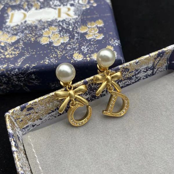 

d / di family 21 new bow asymmetric cd letter pearl earrings female, Red;brown