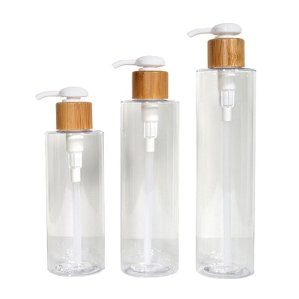 Bottiglia di plastica PET trasparente Forma di colonna circolare Pompa di stampa Colar in legno di bambù Contenitore di imballaggio riutilizzabile cosmetico vuoto 200 ml 250 ml 300 ml