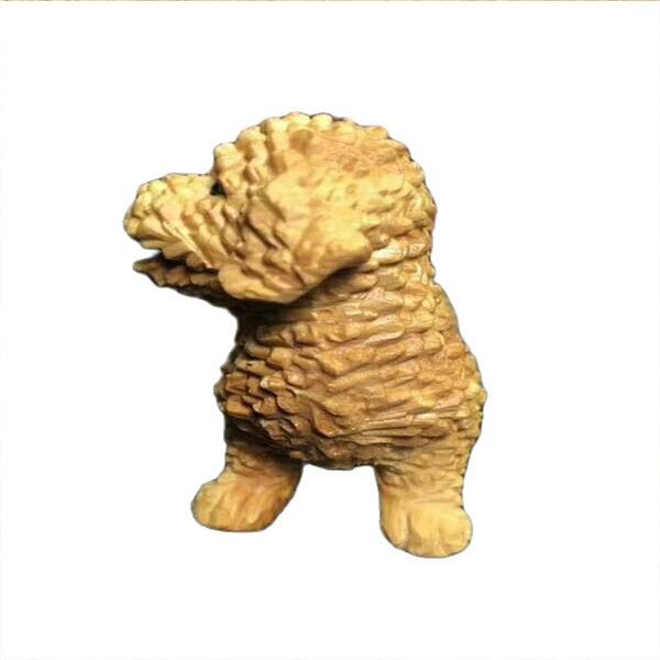 Testo di intaglio del cane dell'orsacchiotto in legno di bosso che suona ornamenti artigianali in mogano sculture in legno.