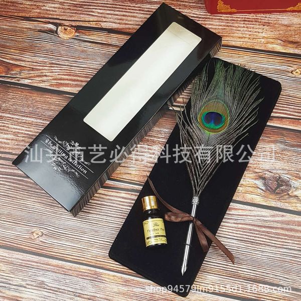 

peacock feather pen dipped in ink writing stationery collection gift