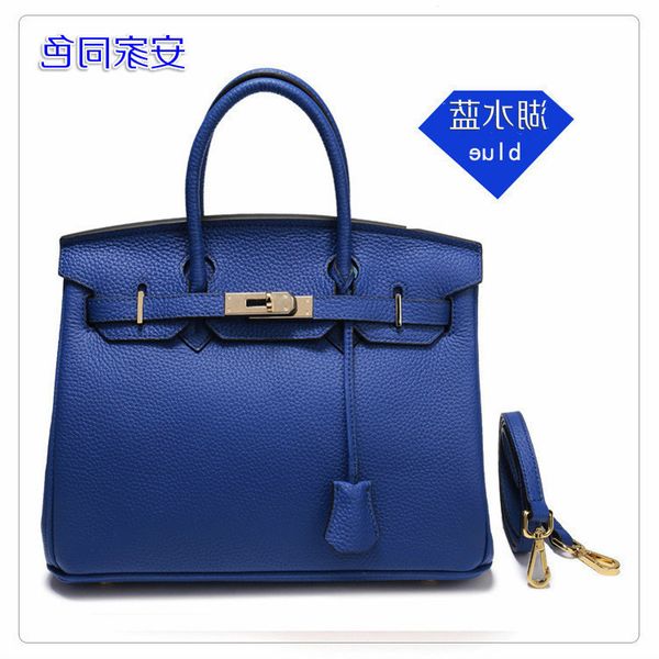 

luxurys womenred style pure handbag xinxinwang litchi skin women's bag, layer of cow leather, portable one shoulder messenger leathertp