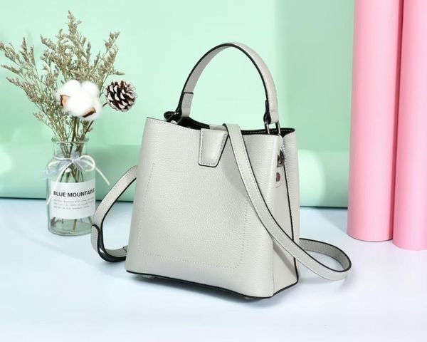 

bucket bag 2021 trend simple head leather one shoulder women's litchi pattern portable messenger waist bags