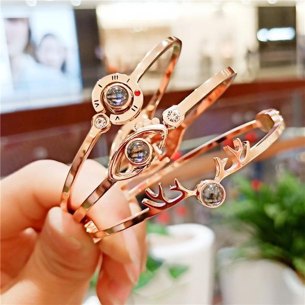 

charm bracelets 100 languages i love you bracelet stainless steel eyes roman letter deer bangles for women, Golden;silver