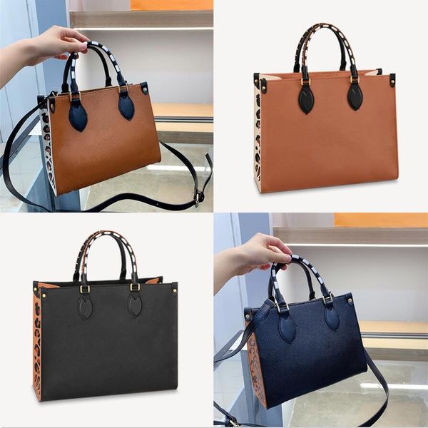 

onthego mm pm gm totes bags caramel wild at heart embossed leather luxurys designers bags leopard business shopping handbags on the go