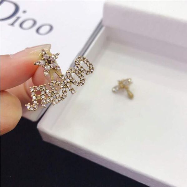 

earrings cuff stud d family's asymmetric bee tassel and in 2021, Golden