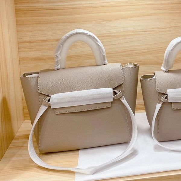 

design hand catfish cow autumn and 2020 new leather pico wing one shoulder slant cross portable women's bridal bag, Red;black