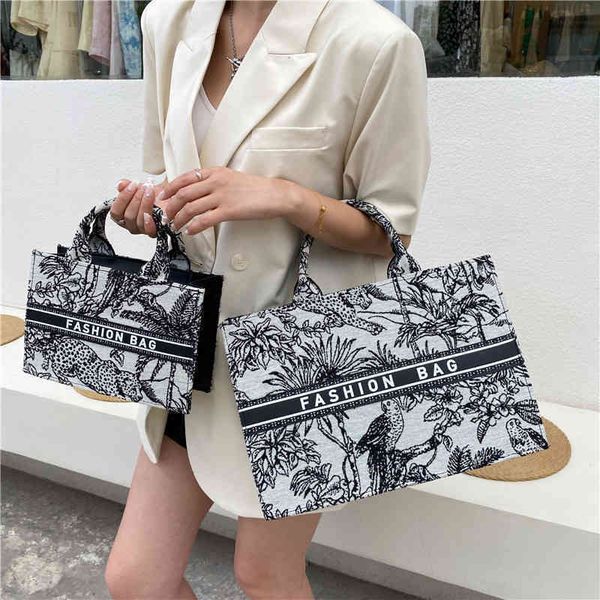 

2022 factory wholesale new spring and summer trendy net red large capacity fashionable embroidery single shoulder women's portable tote, Black;red