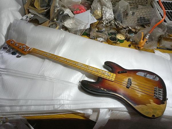 

factory 4 strings electric bass guitar,maple fretboard,relic style bass,dots block inlay,chrome hardwares,can be customized