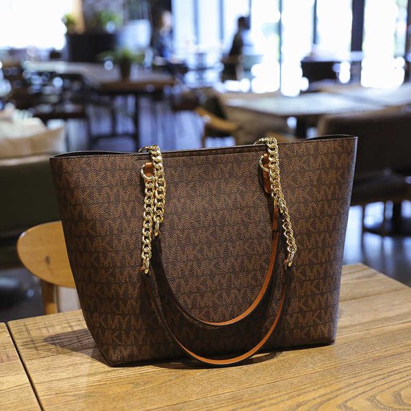 

guangzhou women's 2021 new trend hand old flower child mother's bag large capacity single shoulder messenger bag