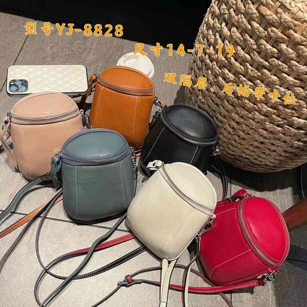 

70% off design hand 2021 summer new small round head soft cow vertical mobile phone leather fashion personality one shoulder slant span bag, Red;black