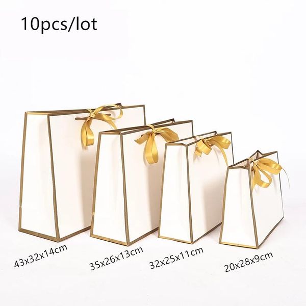 

pajamas, clothes, school bag, large golden gift box, handle, carton kraft paper bag (with handle) wrap