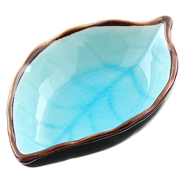 

ceramic case of tomato dish from kitchen sauce in the form of multipurpose leaf for useful food, sauce, dung basins from tomato paste