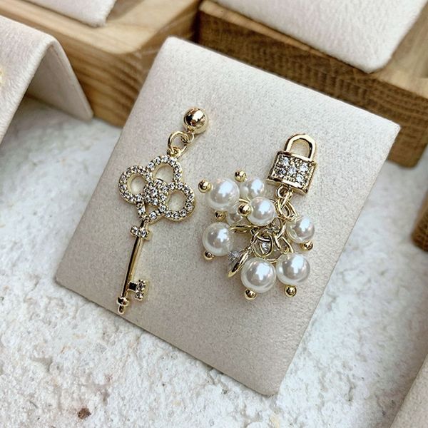 

gate east silver key needle lock pearl earrings simple asymmetric diamond korean temperament net red hundred, Golden;silver
