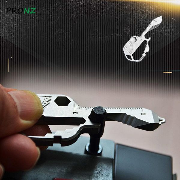 

hooks & rails multi-tool key for the modern featuring slotted screwdrivers keychain bottle opener stainless steel outdoor repair tools