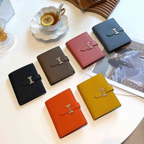 

the first layer of soft cow leather short wallet women's is small, ultra-thin and simple. 2021 folding comes with a gift, Red;black