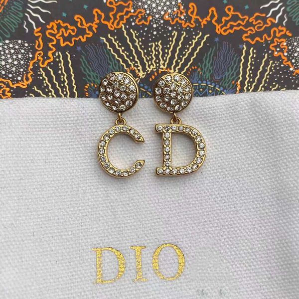 

2021 new letter inlaid diamond female style round earrings, Silver