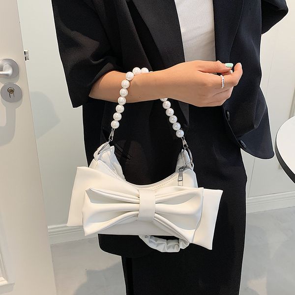

2021 korean wind pearl small fresh and one bow female sweet shoulder bag version of chain fashion messenger popular exkdt