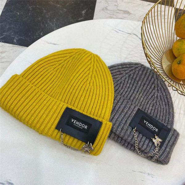 

autumn and winter thickened woolen children's versatile leather label butterfly chain decoration warm ear protection knitted hat, Yellow