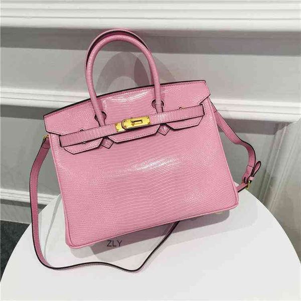 

2021 new lizard head leather one shoulder straddle hand bag soft coverzlyzlyluxury bags factory outlet