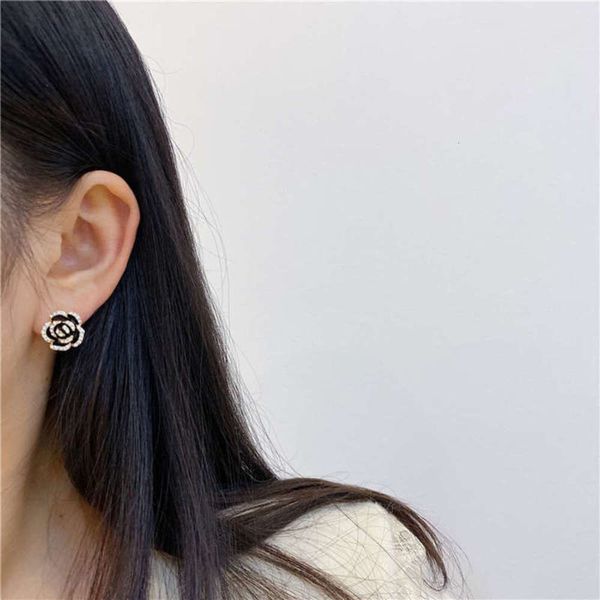 

french temperament mountain camellia zircon women's creative light luxury cold wind design simple small earrings, Black