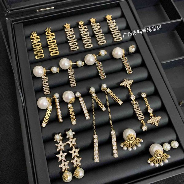 

2021 new designer family's letter pearl earrings in 2021, Golden