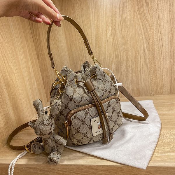 

kuqi bear hourglass fashion trend double belt women's single shoulder small fresh messenger handbag