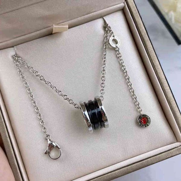 

the new baojia charity little red man necklace 925 silver black ceramic cnc spring white silver male and female couple clavicle chain