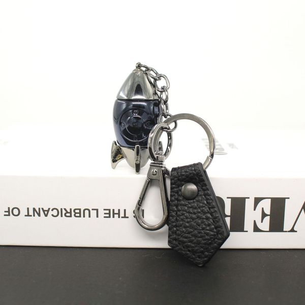 

mens and womens schoolbags imitation titanium alloy cartoon rocket small gift key chain pendant pendant astronaut car key ring, Slivery;golden