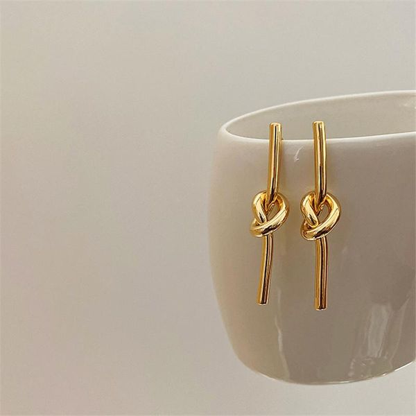 

dangle & chandelier aomu simple retro gold color metal long knotted earrings irregular geometric smooth reflective cross drop for women, Silver