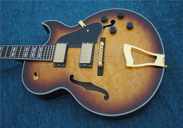 

jazz electric guitar, yellow, hollow body, gold hardware, hot