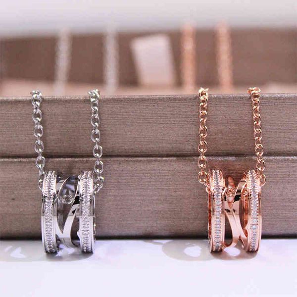 

the new baojia titanium steel small waist necklace female rose gold little red man hollow out double row with diamond spring pendant, Silver