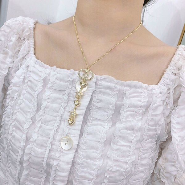 

c1955 short necklace imitation pearl star crystal long fringe pendant trendy golden multi-layer heart-shaped letter sweater chain, Silver