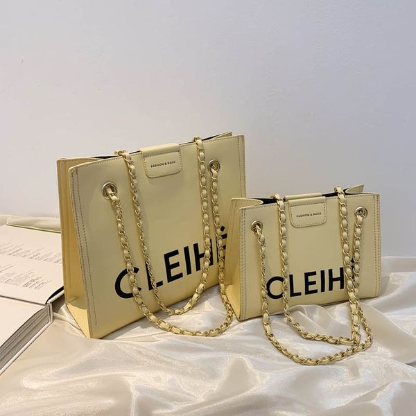 

factory outlet design female tote new 2021 fashion letter chain bucket bag simple matching pu single shoulder messenger bag