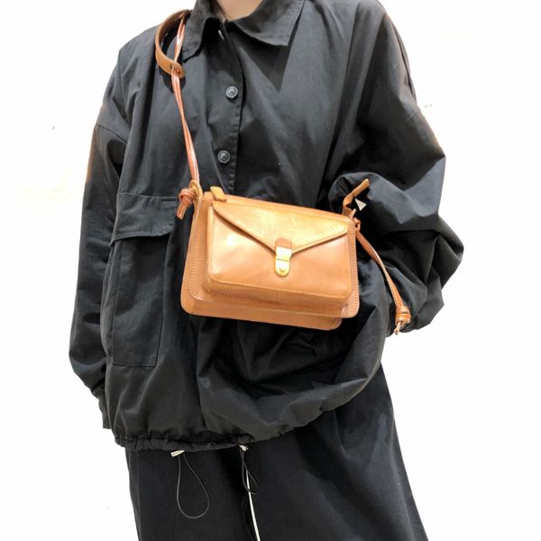 

hand made primary color head single shoulder bag with worn leather