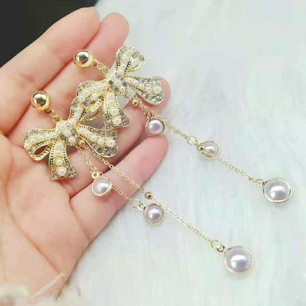 

exaggerated simple style bow pearl full of diamond personality fashion long tassel chain earrings female, Black