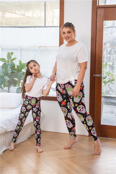 

women's leggings mommy daughter cartoon sugar skulls, Black