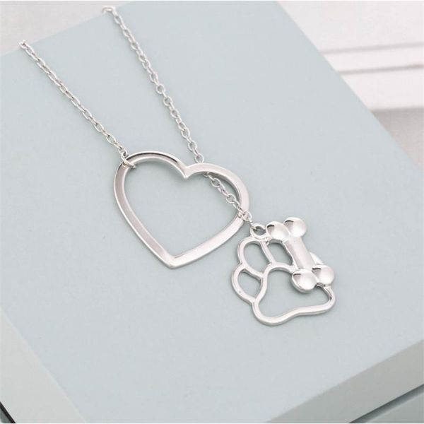 

pendant necklaces europe and the united states is hollow-out love dog bone necklace female creative pet small adorn article, Silver