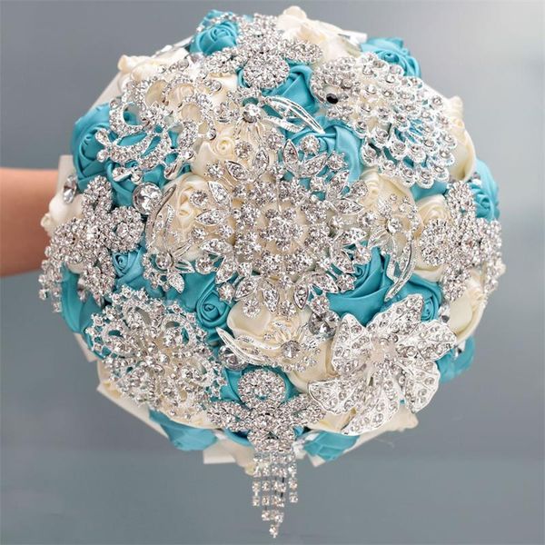 

wedding flowers lake blue milk white ribbons roses bouquet tassel brooch bridal holding bling diamond bride artificial bouquets
