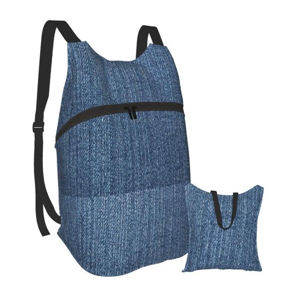 

foldable backpack waterproof travel men bag denim background