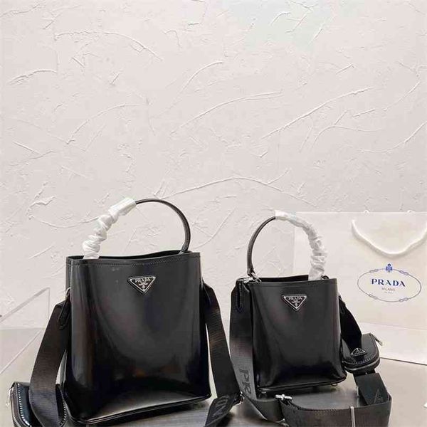 

lacquer triangle bucket bag in early autumn 2021 luxuryss designerss yw